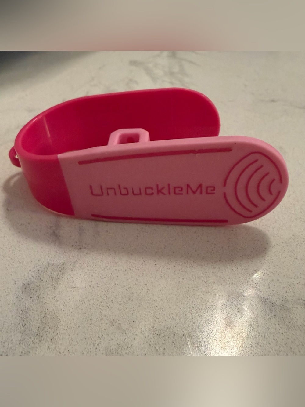 Unbuckleme pink tool for car seat buckle
